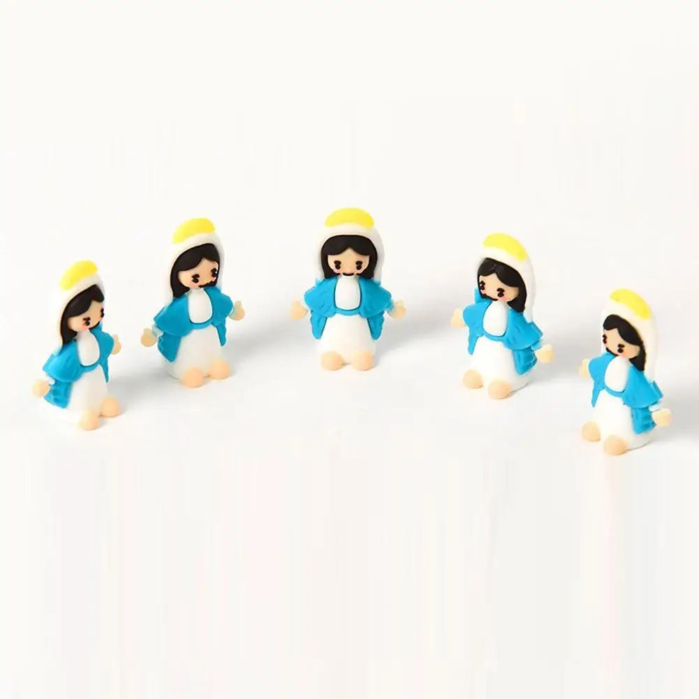 A set of five mini Maria religious desktop figurines with black hair, white bodies, and blue outfits and yellow hair.