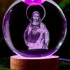 A 3D crystal ball night light featuring a silhouette of Jesus with a halo, glowing purple.