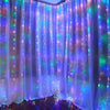 Purple and blue fairy lights draped across sheer curtains creating a magical backdrop