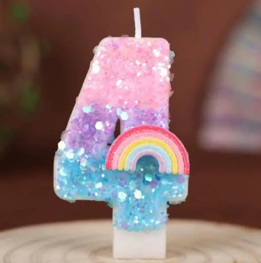 A colorful candle shaped like the number 4 made of pink, purple, and blue glitter and rainbow sequins.