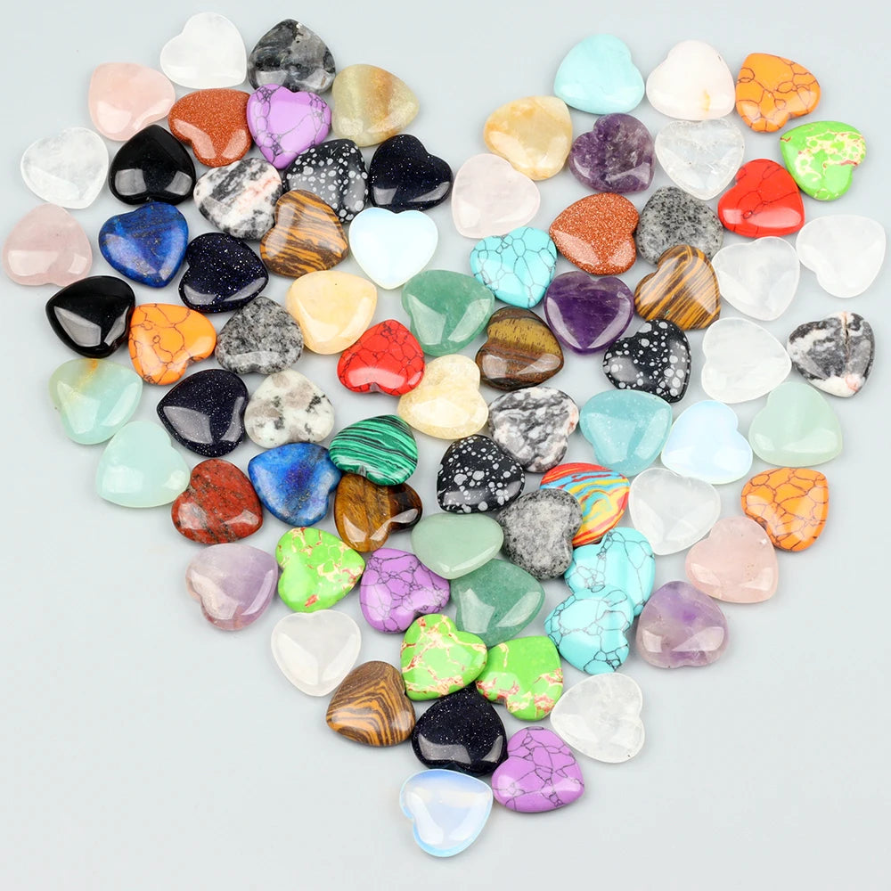 A heart shape composed of numerous polished amethyst crystal stones in various shades of purple, pink, green, and clear white