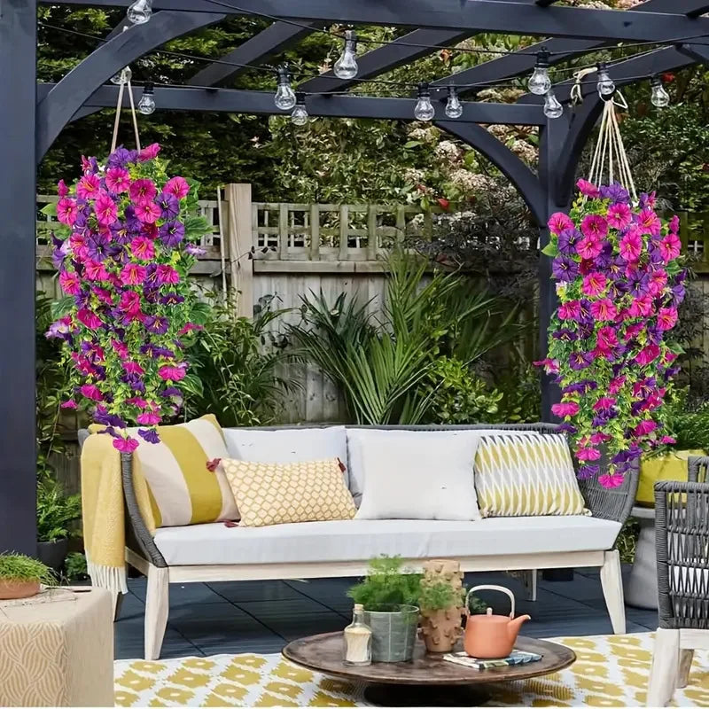 Artificial hanging silk morning glory flowers displayed in a garden setting.