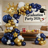 A balloon arch display featuring navy blue, white, and gold balloons for a graduation party theme.