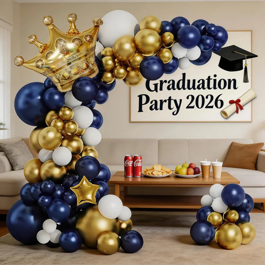 A balloon arch display featuring navy blue, white, and gold balloons for a graduation party theme.