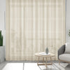 Light beige natural linen sheer curtains hanging in a window for a living room setting.
