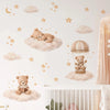 Wall stickers featuring cartoon bears, stars, and clouds decorating a nursery room