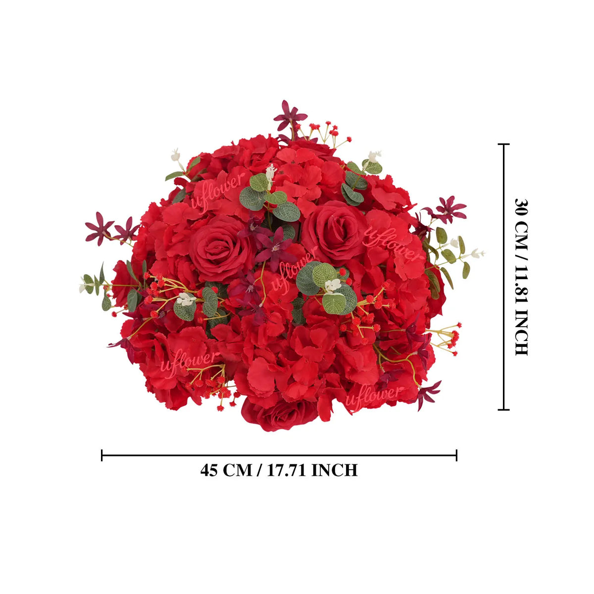 A dense, round bouquet of deep red silk roses and greenery used as a centerpiece.