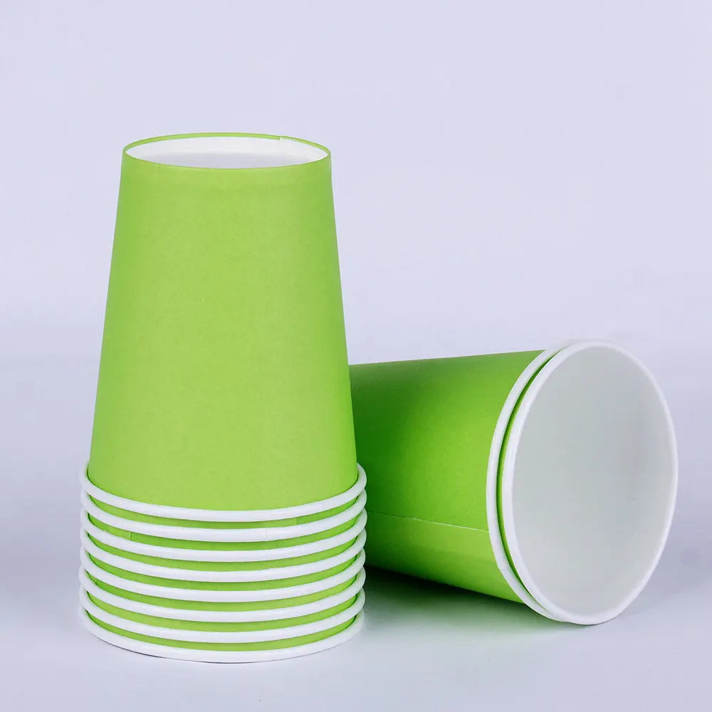 A stack of bright lime green disposable cups with white rims.