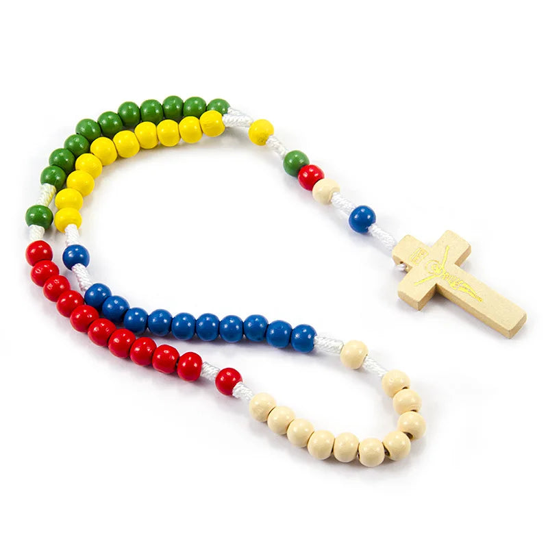 A wooden rosary beads necklace featuring various colored beads and a small wooden Jesus crucifix.