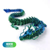 A detailed resin figurine of a conjoined dragon in laser green and blue colors.