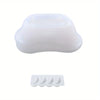 White silicone mold shaped like a bathtub for storing candles and wax.