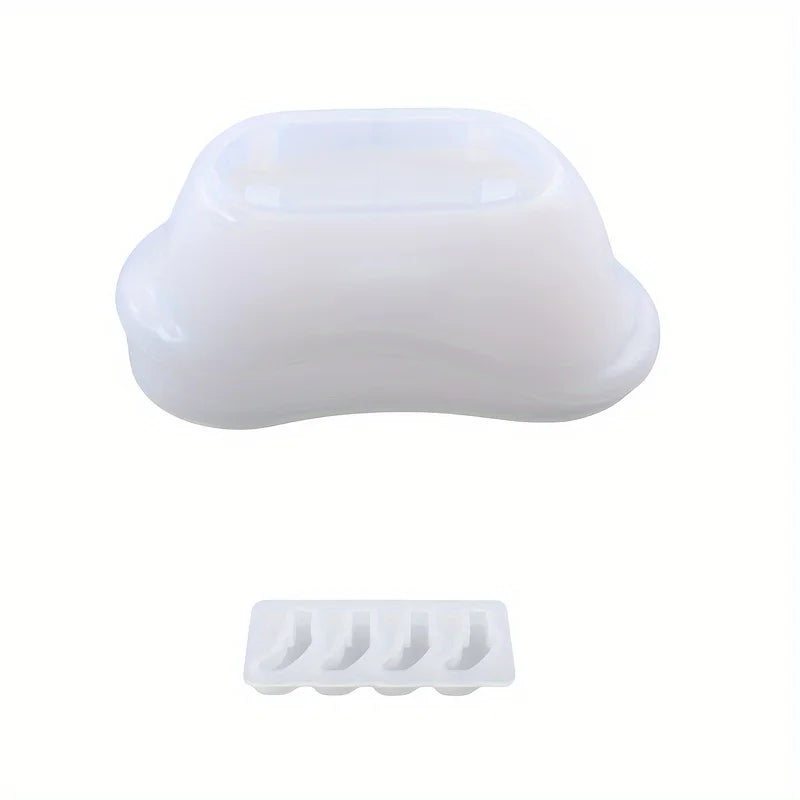 White silicone mold shaped like a bathtub for storing candles and wax.