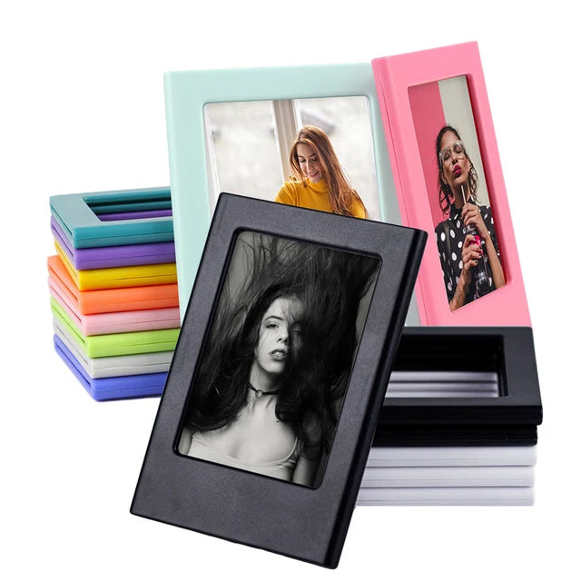 A set of magnetic double-sided frames in pink and mint green, with a framed photo of a woman.