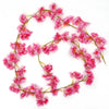 Pink sakura flower garland with delicate pink blossoms arranged in a circular shape.