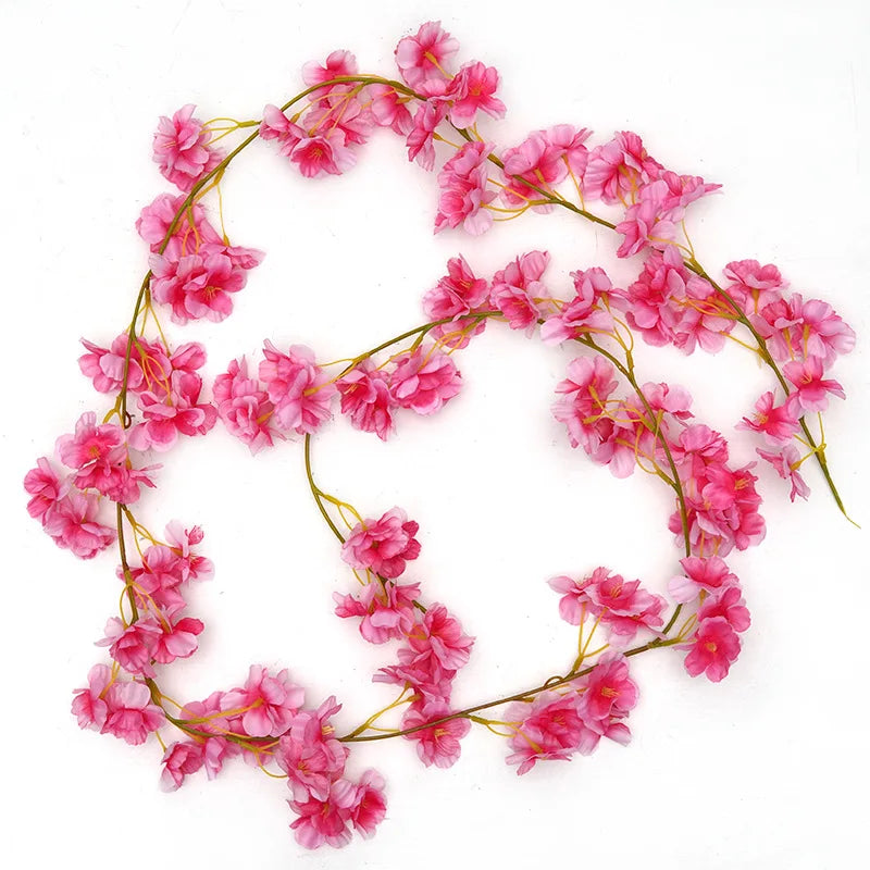 Pink sakura flower garland with delicate pink blossoms arranged in a circular shape.