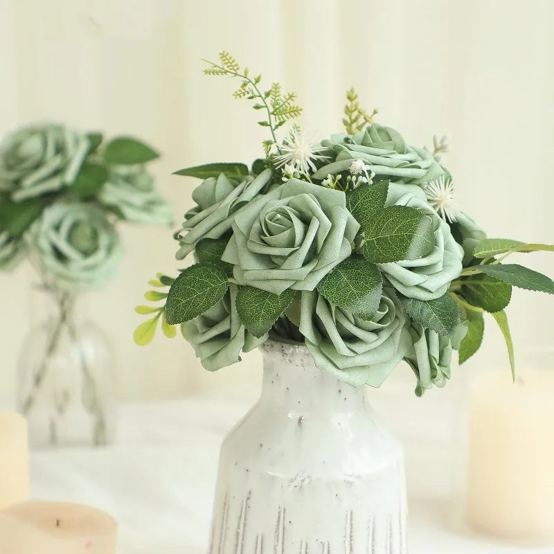 A bouquet of forest green ombre foam roses with stems arranged in a white vase.