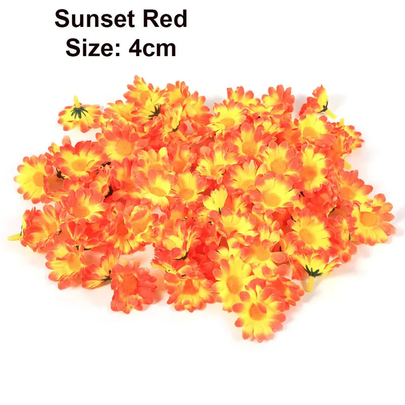 A pile of bright orange and yellow artificial sunflower and daisy heads for decoration.