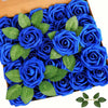 A dense arrangement of thirty artificial blue roses with green leaves in a brown box.