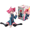 A pink Hatsune Miku PVC collectible figurine standing next to its original box.