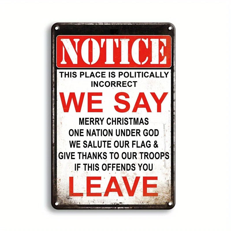 A vintage metal tin sign with red and white text that reads NOTICE WE SAY MERRY CHRISTMAS ONE NATION UNDER GOD WE SALUTE OUR 