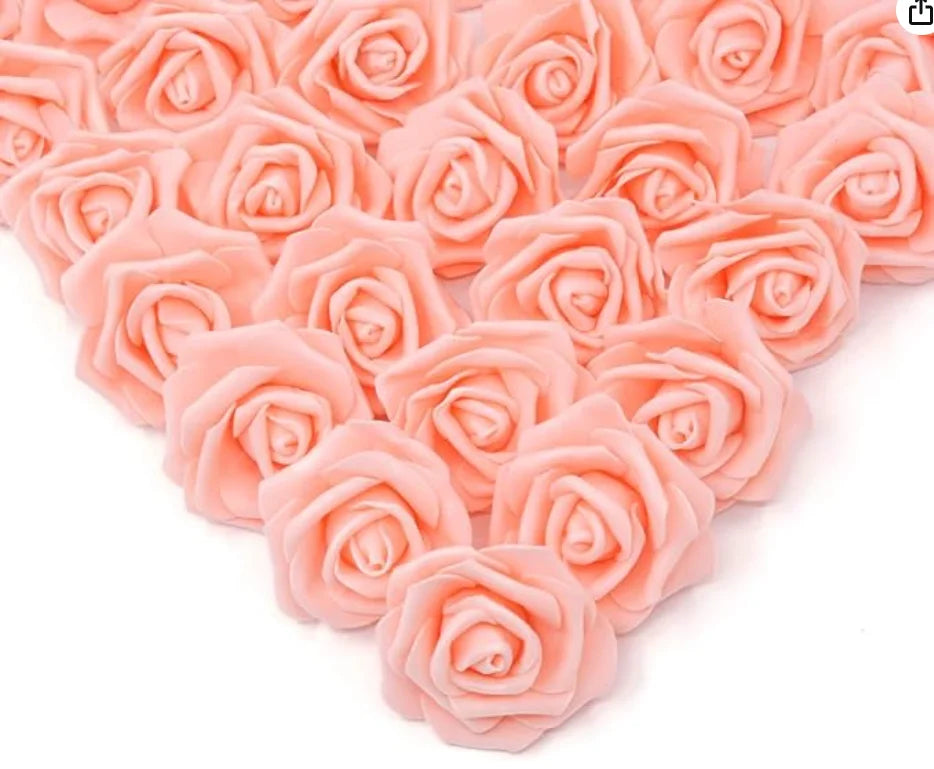 A close-up view of pink artificial foam rose decorations arranged in a cluster.