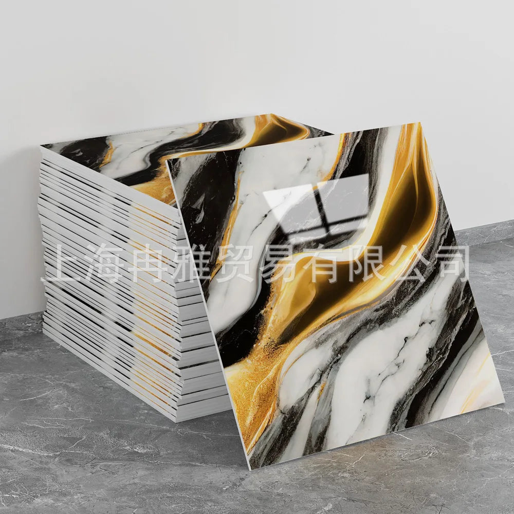 A stack of faux marble 3D self-adhesive wall tiles featuring black, white, and gold veining.
