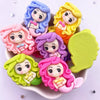 A collection of colorful resin figurines depicting mermaid princesses with flowing hair and cute expressions.