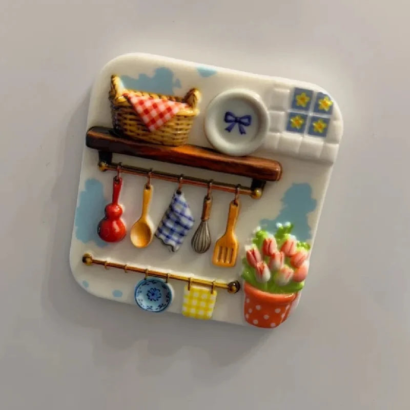 A white resin fridge magnet featuring a woven basket, various utensils, and a potted flower.