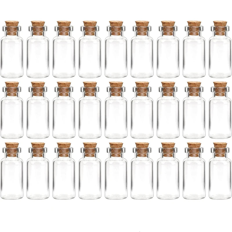 A row of clear glass bottles with cork stoppers for DIY decor.