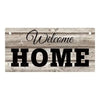 Rustic wooden hanging sign with the words Welcome Home carved into the wood.