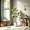 A tall artificial magnolia tree with pink silk flowers in a white pot displayed on a light wood table.