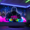 A person wearing a hoodie is centered in front of a neon cityscape background with pink and purple light effects.