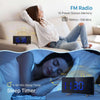 A projection alarm clock with a large LED display and FM radio is shown in use for sleep timing.