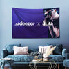 A purple banner featuring the Deezer and Jul logos against a starry background displayed on a wall.