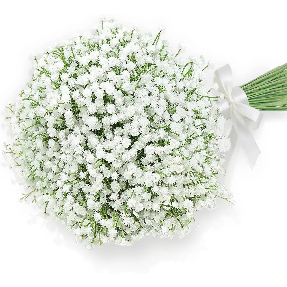 A bouquet of white baby's breath flowers tied with a white ribbon.