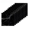 Black marble effect self-adhesive wall stickers arranged in a diagonal grid pattern.