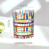 A stack of faceted crystal whiskey glasses with multicolored designs and a 300ml capacity.