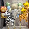 A set of eight foil balloons depicting various jungle safari animals including a lion, elephant, giraffe, and zebra.