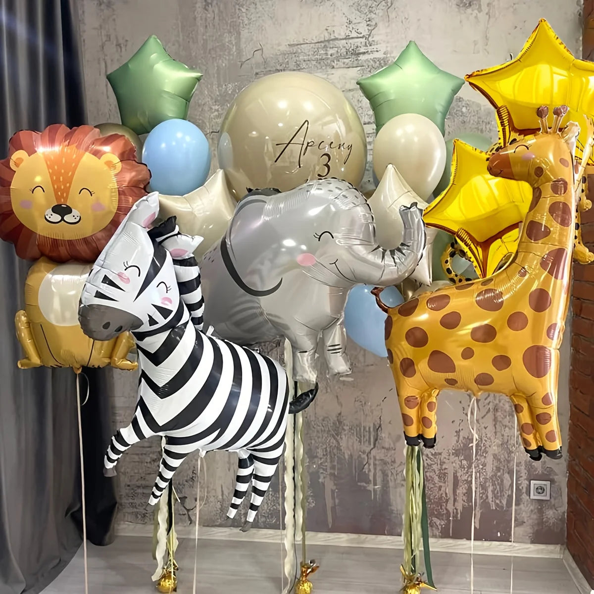 A set of eight foil balloons depicting various jungle safari animals including a lion, elephant, giraffe, and zebra.