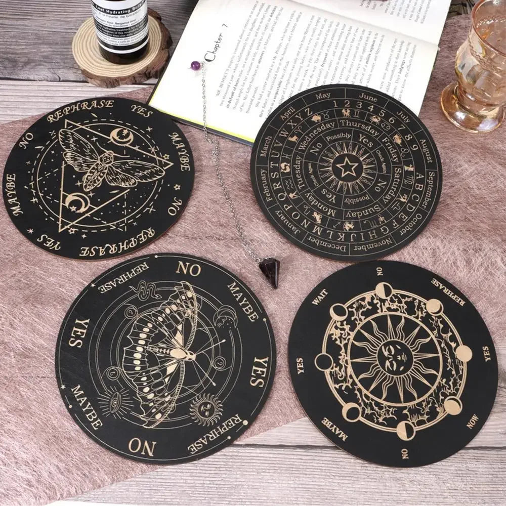 A set of five black wooden divination cards featuring celestial symbols and words like Yes, No, Maybe, and Rephrase.