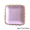 Eight 7-inch purple and gold party plates with scalloped edges