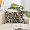 A decorative pillow cover featuring a leopard print pattern on a light beige cushion.