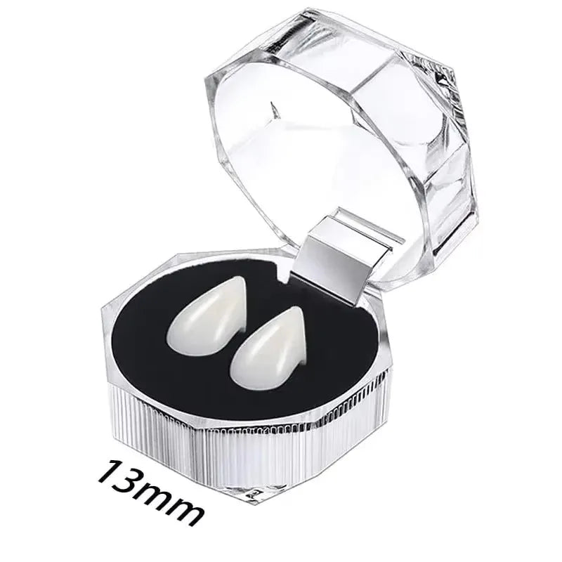 Clear acrylic container holding realistic vampire fangs with an adjustable fit