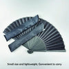 A black folding hand fan with a bamboo frame shown in a fan shape.