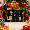 A collection of metallic foil rose flower gift sets in various colors and packaging displayed in a festive holiday setting.