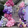 A colorful balloon column set featuring pink, purple, and silver balloons arranged in a tiered display.