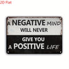 A distressed metal sign with the text "A NEGATIVE MIND WILL NEVER GIVE YOU A POSITIVE LIFE"