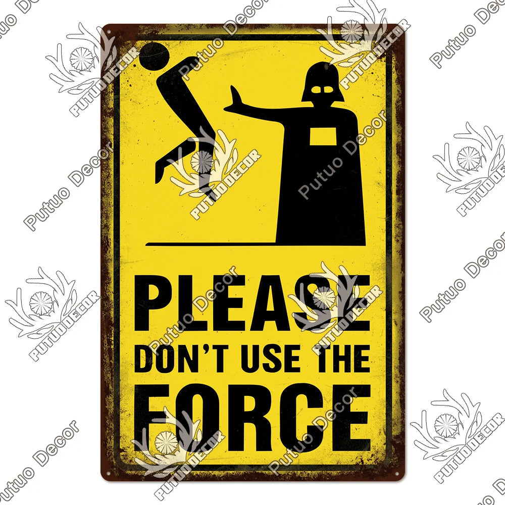 A vintage warning metal sign with a black silhouette of a figure and yellow text that reads Please Don't Use The Force