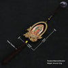 A wooden Our Lady of Guadalupe pendant charm with a gold-colored frame and dark brown tassel.