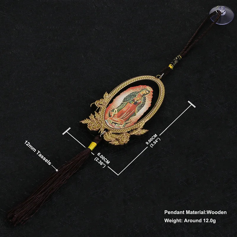 A wooden Our Lady of Guadalupe pendant charm with a gold-colored frame and dark brown tassel.